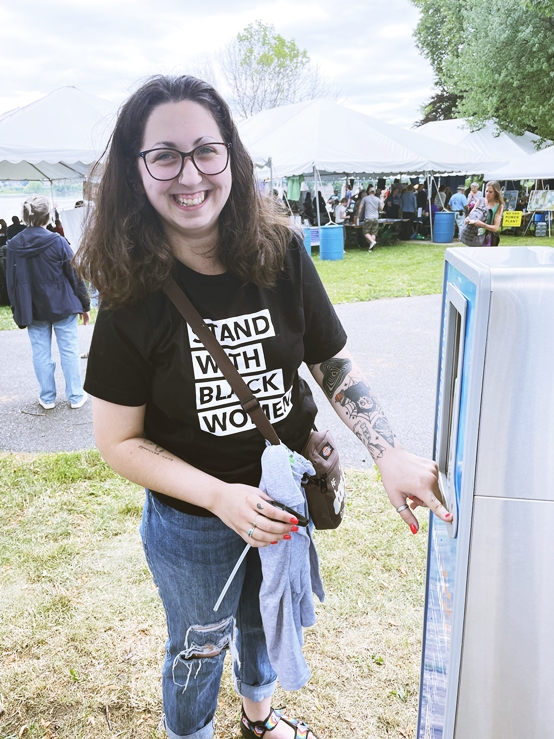 A woman really enjoy using our EVENTA portable bottle refill station