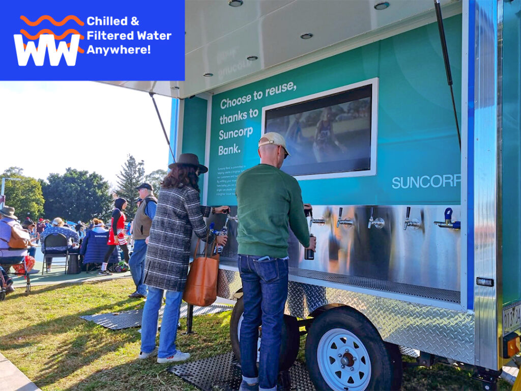 Participants-at-the-SUNCORP-sports-event-are-Filling-their-bottles-with-customized-Chilled-Water-Trailer-Bar