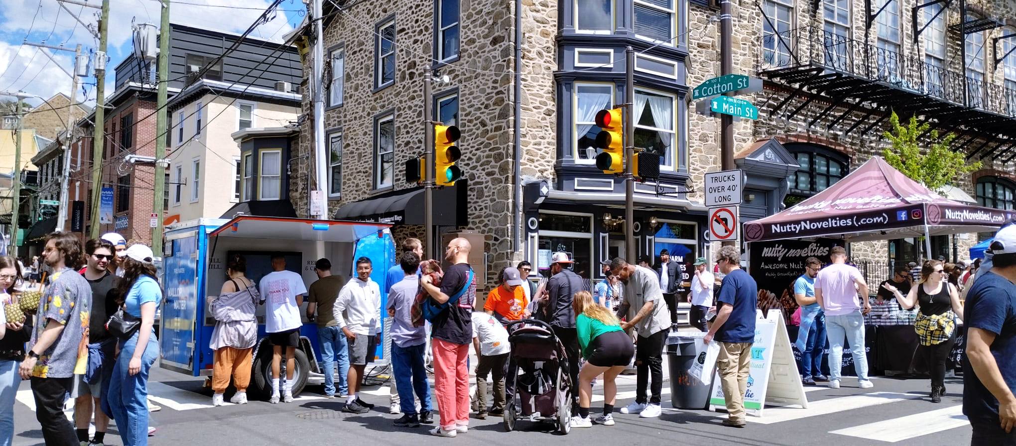 Wallop Water hydration station in a crowded event, cotton st, main st.