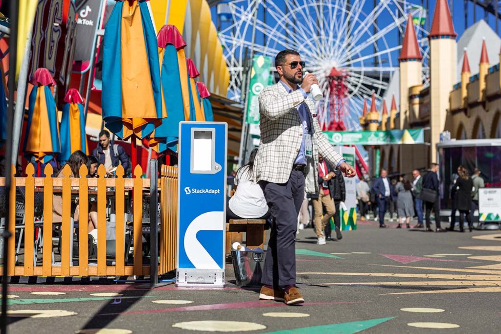 Man walking at colorful amusement park