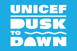 UNICEF Dusk to Dawn logo on blue background