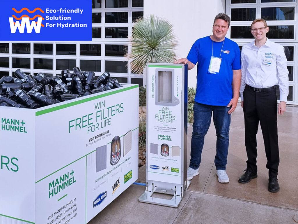 MANN+HUMMEL eco-friendly filters promotion display with Ryan and AAPEX staff.