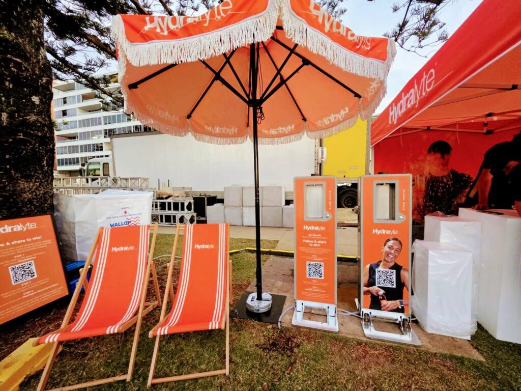 Hydralyte promotional setup with chairs and umbrellas.