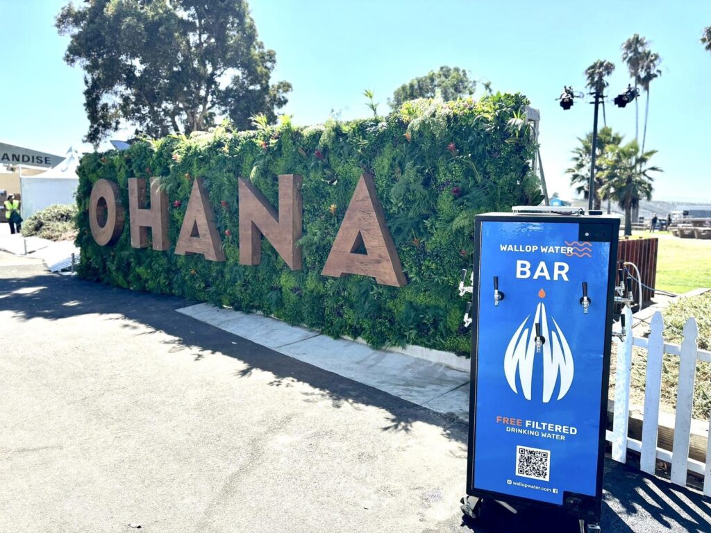 Outdoor Ohana sign with water station nearby