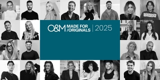O&M 2025 group portrait, diverse individuals smiling.