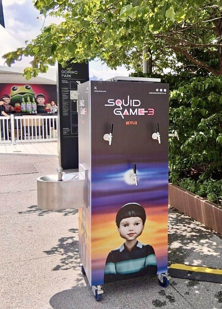 Squid Game themed drink dispenser at Domino Park.