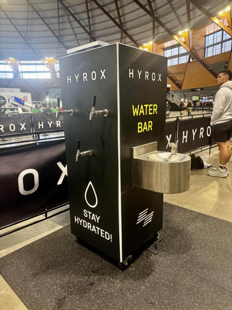 Hyrox water bar for hydration at event.