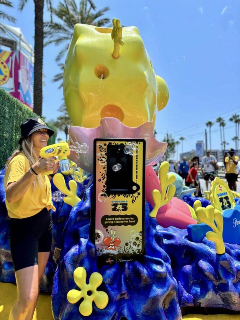 SpongeBob fountain with person using yellow toy blaster.
