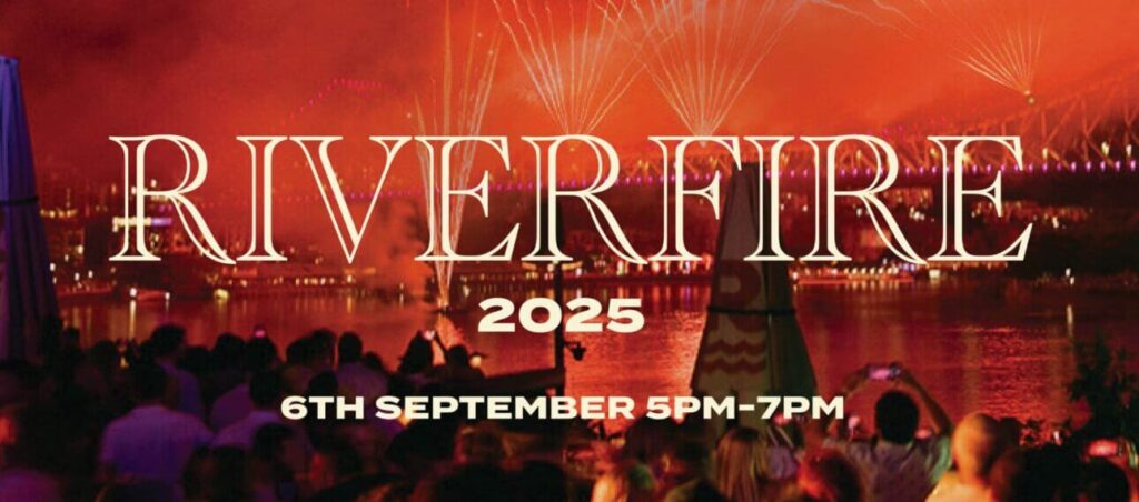 Riverfire 2025 event with fireworks over cityscape.