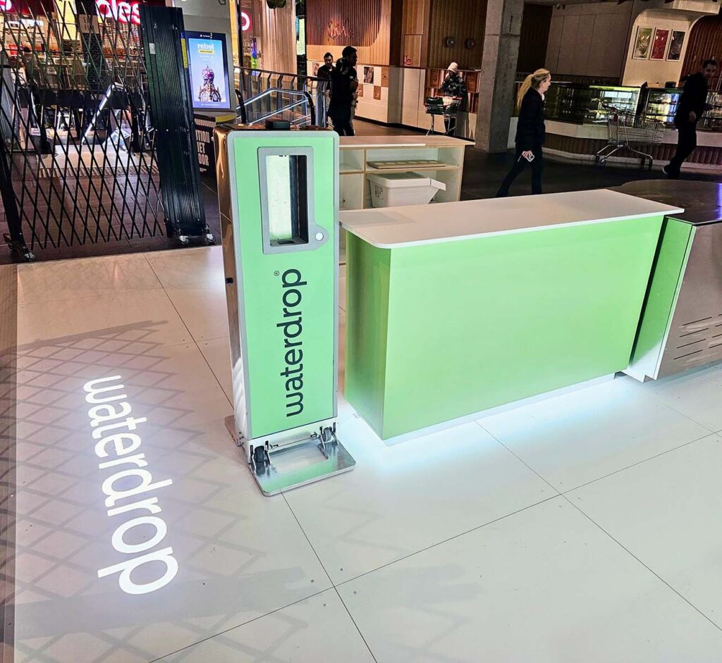 Waterdrop vending machine and counter at a mall.