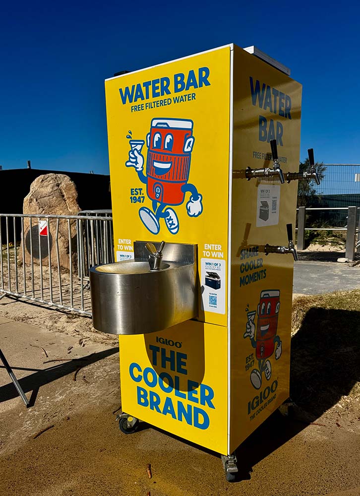 Yellow water dispenser offers free filtered water.