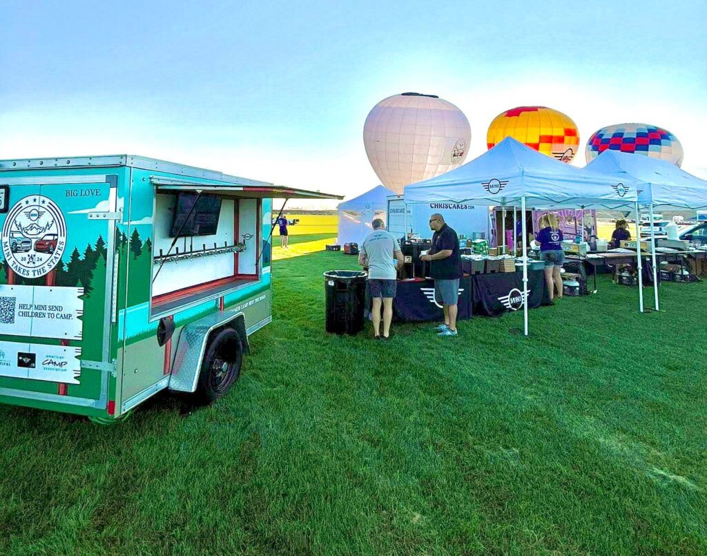 Food truck and tents at balloon event.