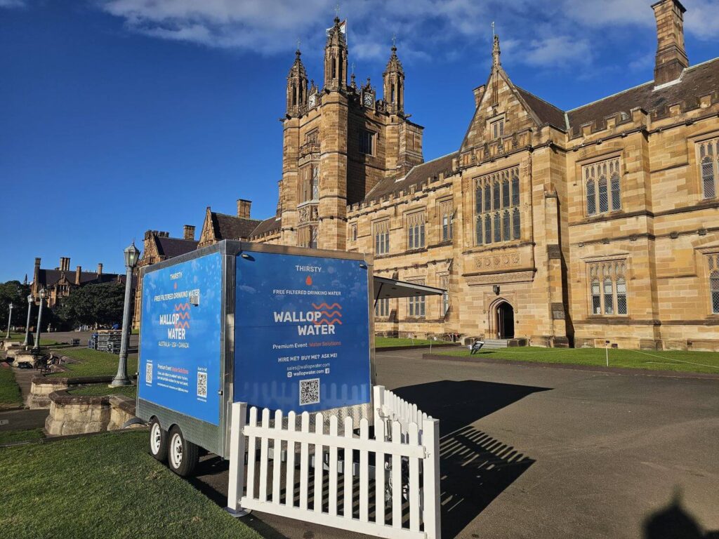 Water station trailer outside historic building