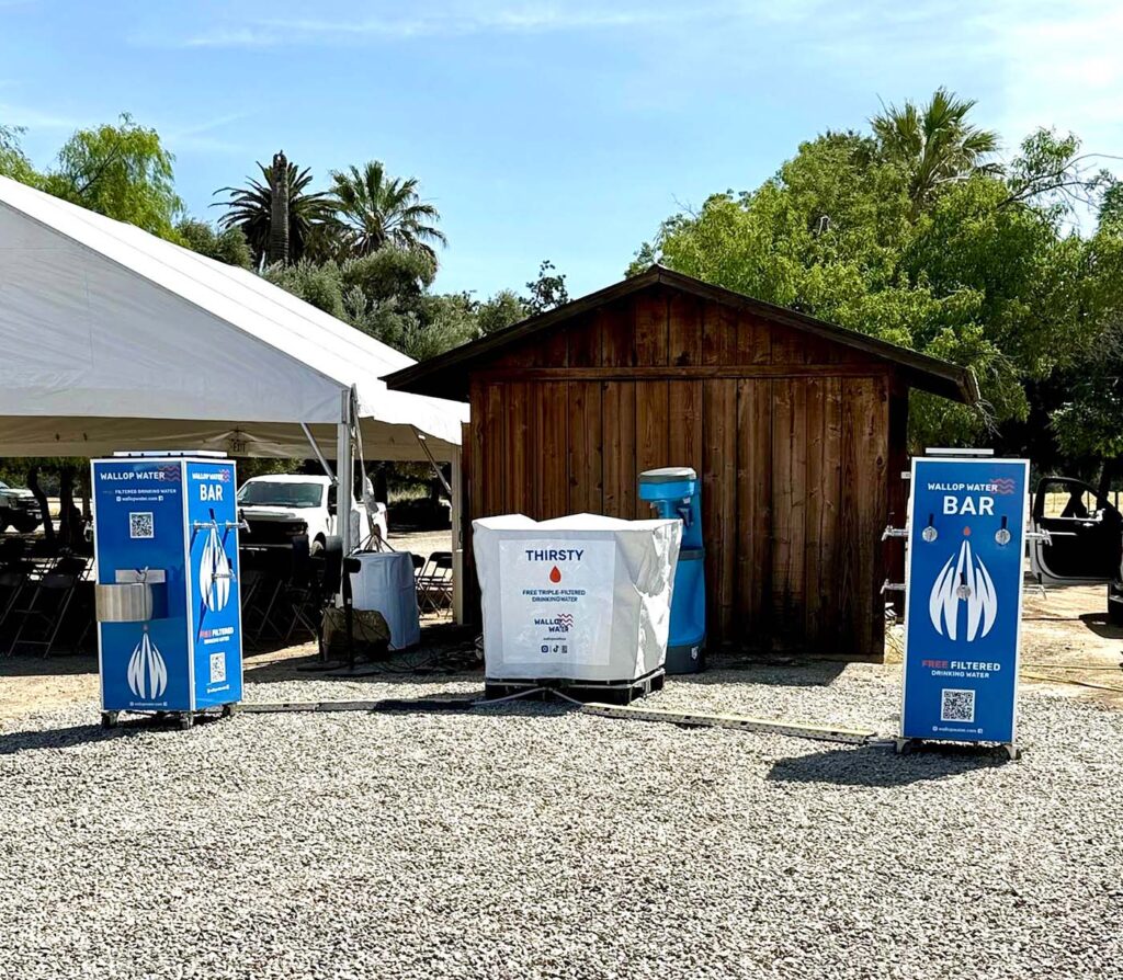 Outdoor filtered water bar setup at an event.