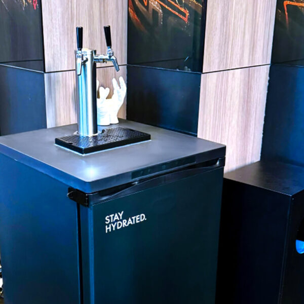 Beverage dispenser with 'Stay Hydrated' message.