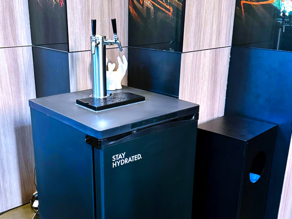 Beverage dispenser with 'Stay Hydrated' message.