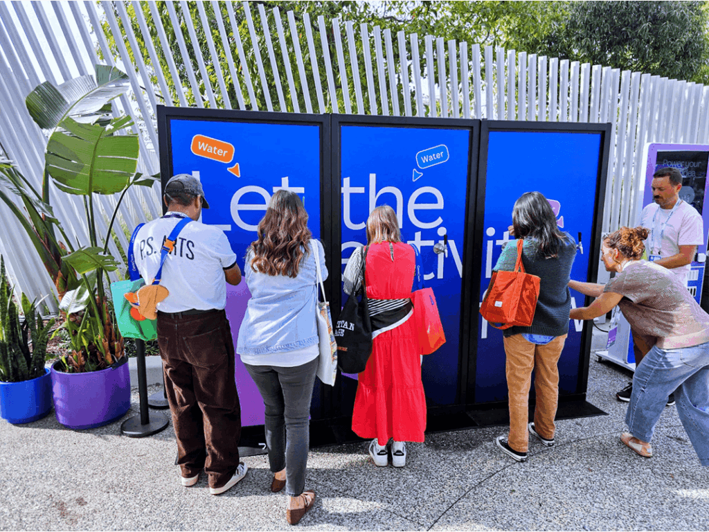 People refilling water bottles at outdoor station