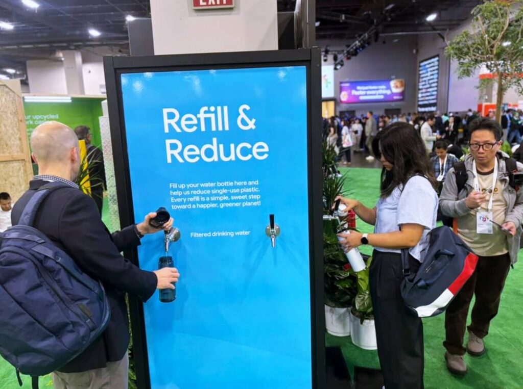People refilling bottles at water refill station