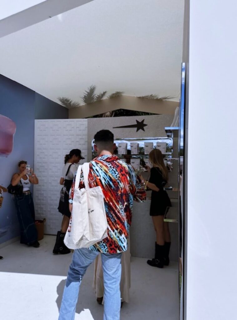 People browsing items at outdoor pop-up booth