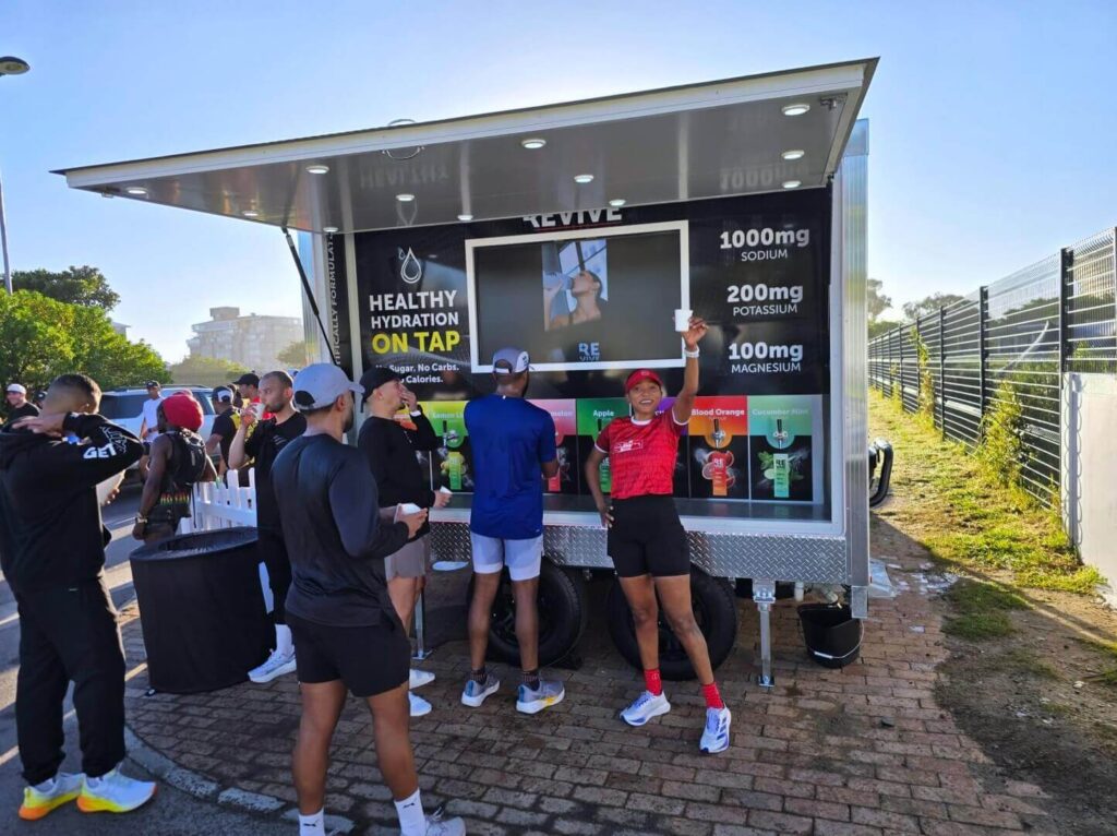 People at outdoor hydration stand after workout
