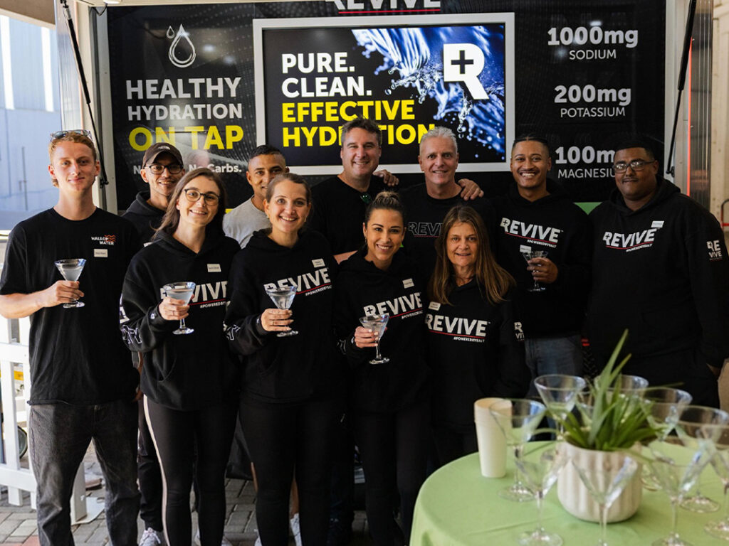 Revive team promoting healthy hydration at event booth
