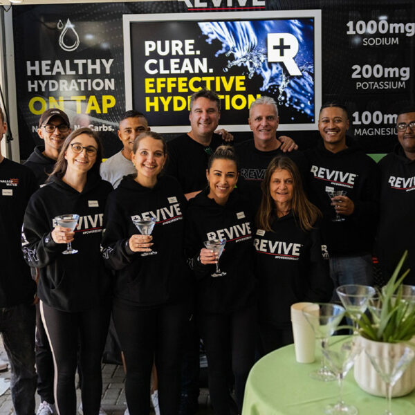 Revive team promoting healthy hydration at event booth